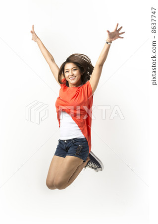 Happy woman jumping in air. 8637747
