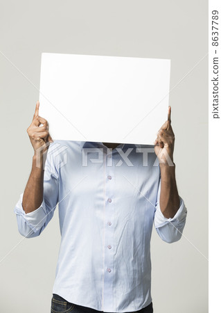 Indian man holding up a banner. Indian man holding up a banner. 8637789
