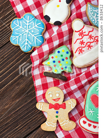 smiling on the background of Christmas gingerbread decorations 8638412