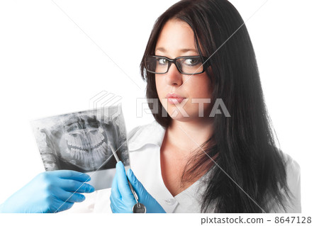 brunette young female dentist holding x-ray isolated on white background brunette young female dentist holding x-ray isolated on white background 8647128