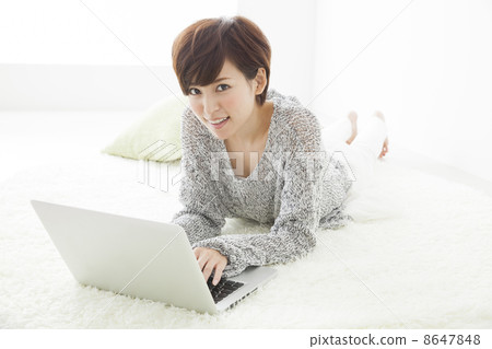 A woman watching a smartphone A woman watching a smartphone 8647848