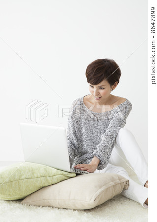 A woman watching a smartphone A woman watching a smartphone 8647899