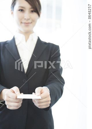Business woman offering business cards Business woman offering business cards 8648257