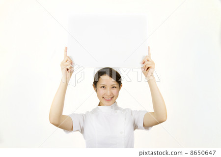 A nurse holding a white board 8650647