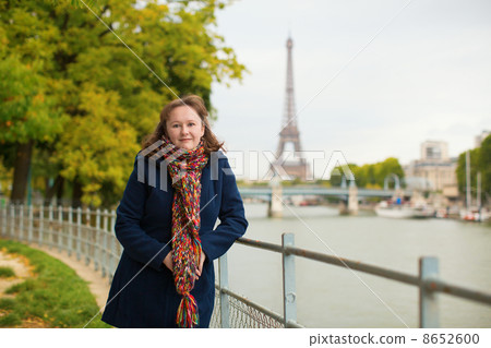 Young woman on a bright fall day in Paris 8652600