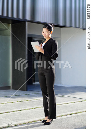 Business woman with tablet PC 8655576