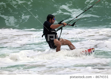 Kitesurfer in action Kitesurfer in action 8674331