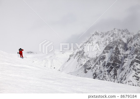 Skier on top of the mountain Skier on top of the mountain 8679184