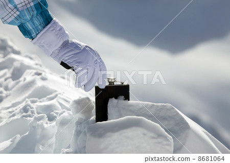 Hipflask in snow 8681064