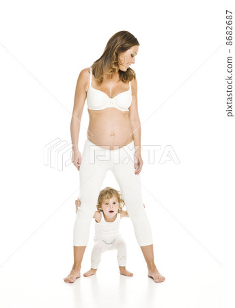 Pregnant woman with her daughter 8682687