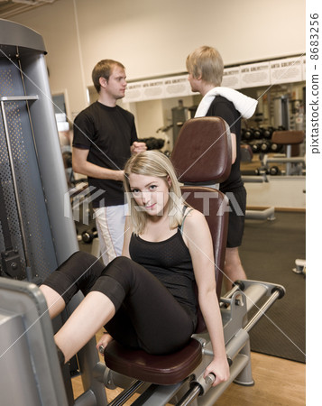 Girl using an exercise machine 8683256