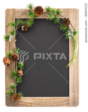 chalkboard with wooden frame and christmas decoration 8684429