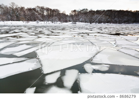 floating of ice on river at early spring evning floating of ice on river at early spring evning 8686279