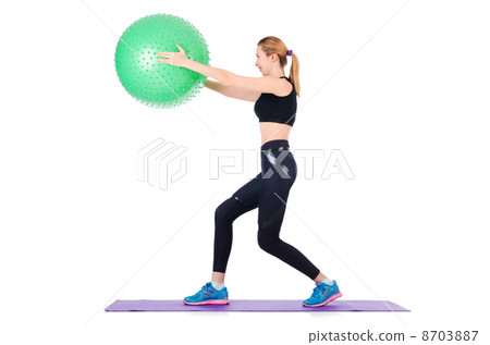Young woman with ball exercising on white Young woman with ball exercising on white 8703887
