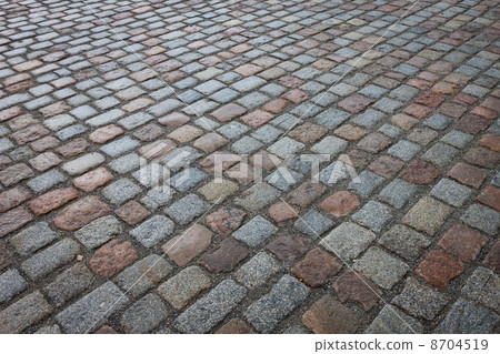 Old wet stone paved avenue street road Old wet stone paved avenue street road 8704519