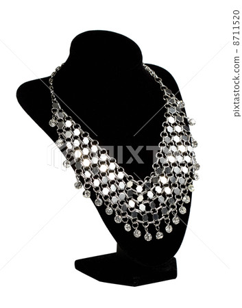 Costume bijouterie on a stand on the white background Costume bijouterie on a stand on the white background 8711520