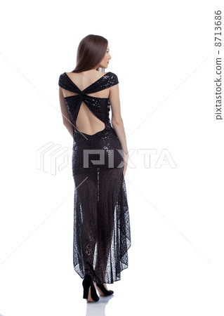 Hot woman in elegant dress posing back to camera Hot woman in elegant dress posing back to camera 8713686