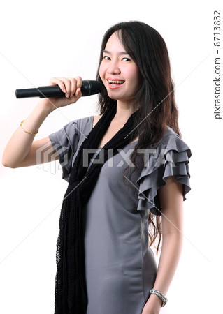 Karaoke girl singing on the white background Karaoke girl singing on the white background 8713832