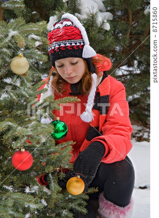 attractive girl with Christmas tree 8715860