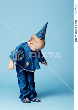 cute little magician portrait on blue cute little magician portrait on blue 8717506
