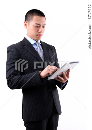 Businessman working on digital tablet 8717652