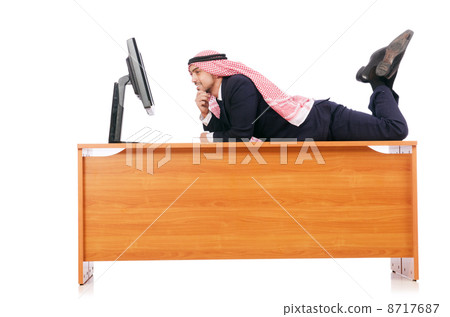 Arab man sitting at his desk Arab man sitting at his desk 8717687