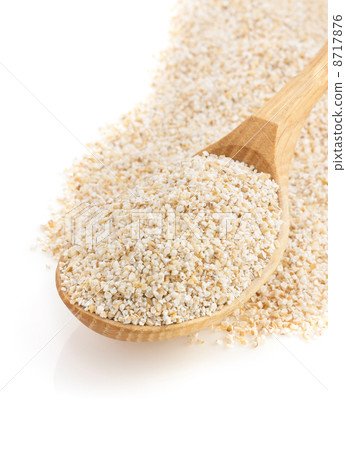 barley  in spoon on white 8717876
