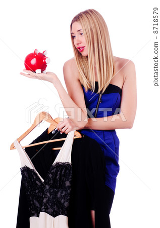 Woman thinking of spending her savings on clothing 8718579
