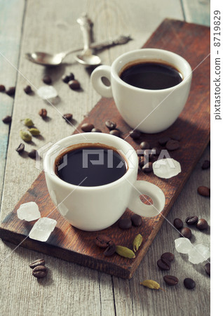 Coffee in cups with spices Coffee in cups with spices 8719829