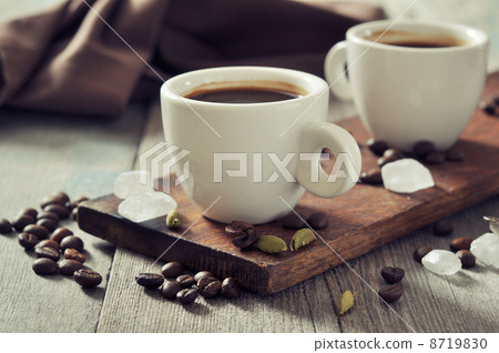 Coffee in cups with cardamom 8719830