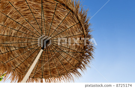 Beach umbrella on sky background Beach umbrella on sky background 8725174