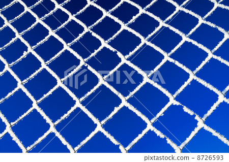 abstract winter background from a lattice against the blue sky abstract winter background from a lattice against the blue sky 8726593