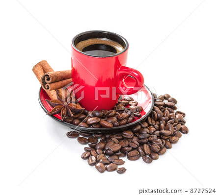 Coffee in a red cup with cinnamon and anise stars. Coffee in a red cup with cinnamon and anise stars. 8727524