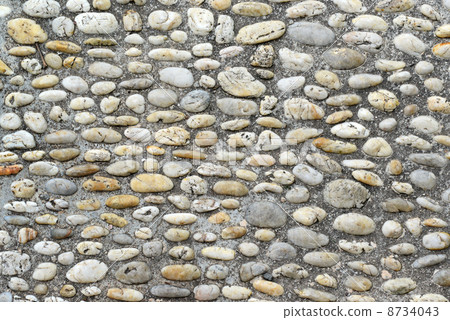 Walking path lined with stones 8734043