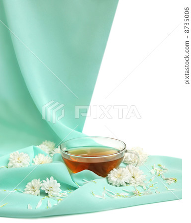 Glass tea cup and flowers Glass tea cup and flowers 8735006