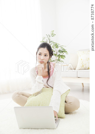 A woman relaxing in the room A woman relaxing in the room 8738774