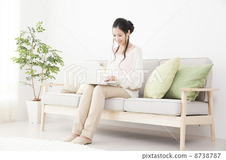 A woman relaxing in the room A woman relaxing in the room 8738787