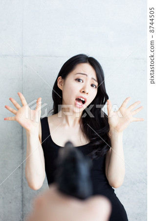 A woman aimed at a gun A woman aimed at a gun 8744505