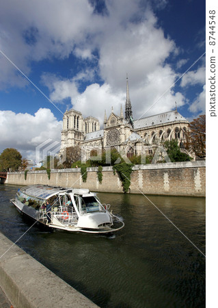 Notre Dame with boat on Seine in Paris, France Notre Dame with boat on Seine in Paris, France 8744548