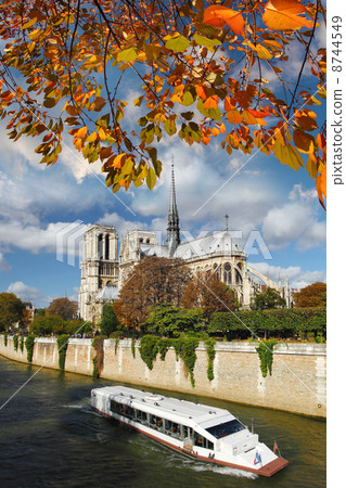 Notre Dame with boat on Seine in Paris, France Notre Dame with boat on Seine in Paris, France 8744549