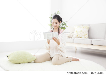 A woman relaxing in the room A woman relaxing in the room 8745606