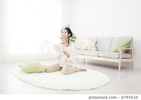 A woman relaxing in the room 8745610