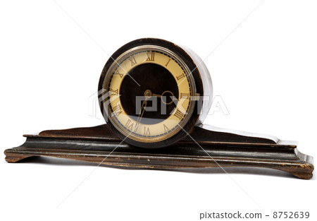 Antique wooden table clock on a white background. Antique wooden table clock on a white background. 8752639