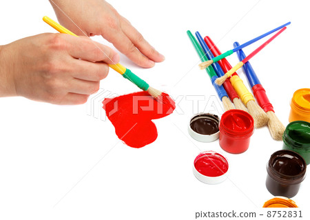 Female hand with brush paint draws the heart. Female hand with brush paint draws the heart. 8752831