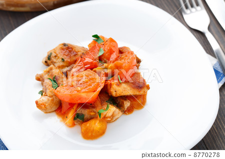 Fried pork with pan-roasted tomatoes 8770278