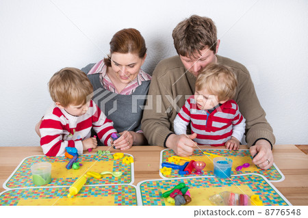 Happy family of a four having fun at home 8776548