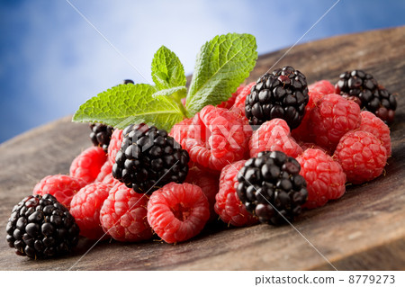 Berries on wooden table 8779273