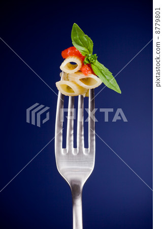 Fork with pasta and tomato sauce 8779801