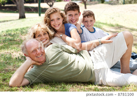 Family lying in the park Family lying in the park 8781100