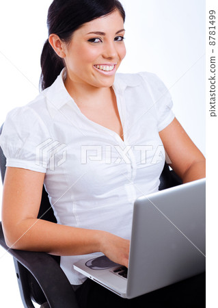 Young attractive business woman smiling while surfing the net Young attractive business woman smiling while surfing the net 8781499